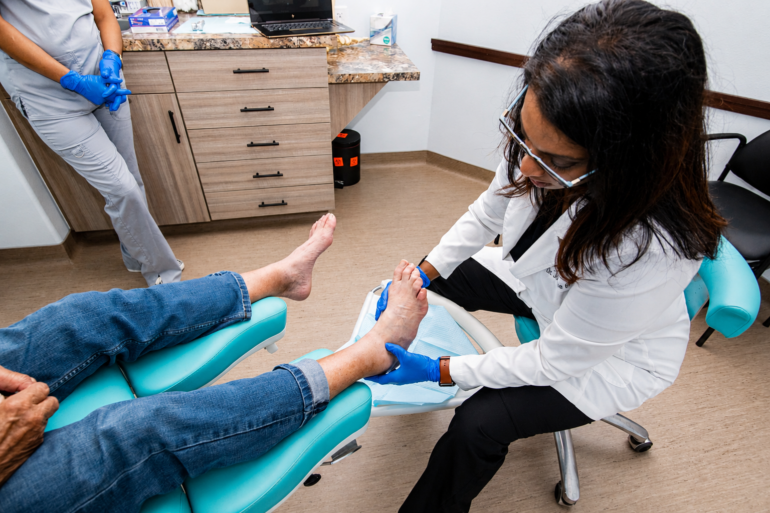 Dr. Balkaran examining a patient during a regenerative medicine visit